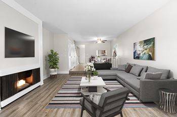 A modern living room with a fireplace at Parkway Plaza Apartments, California, 90230